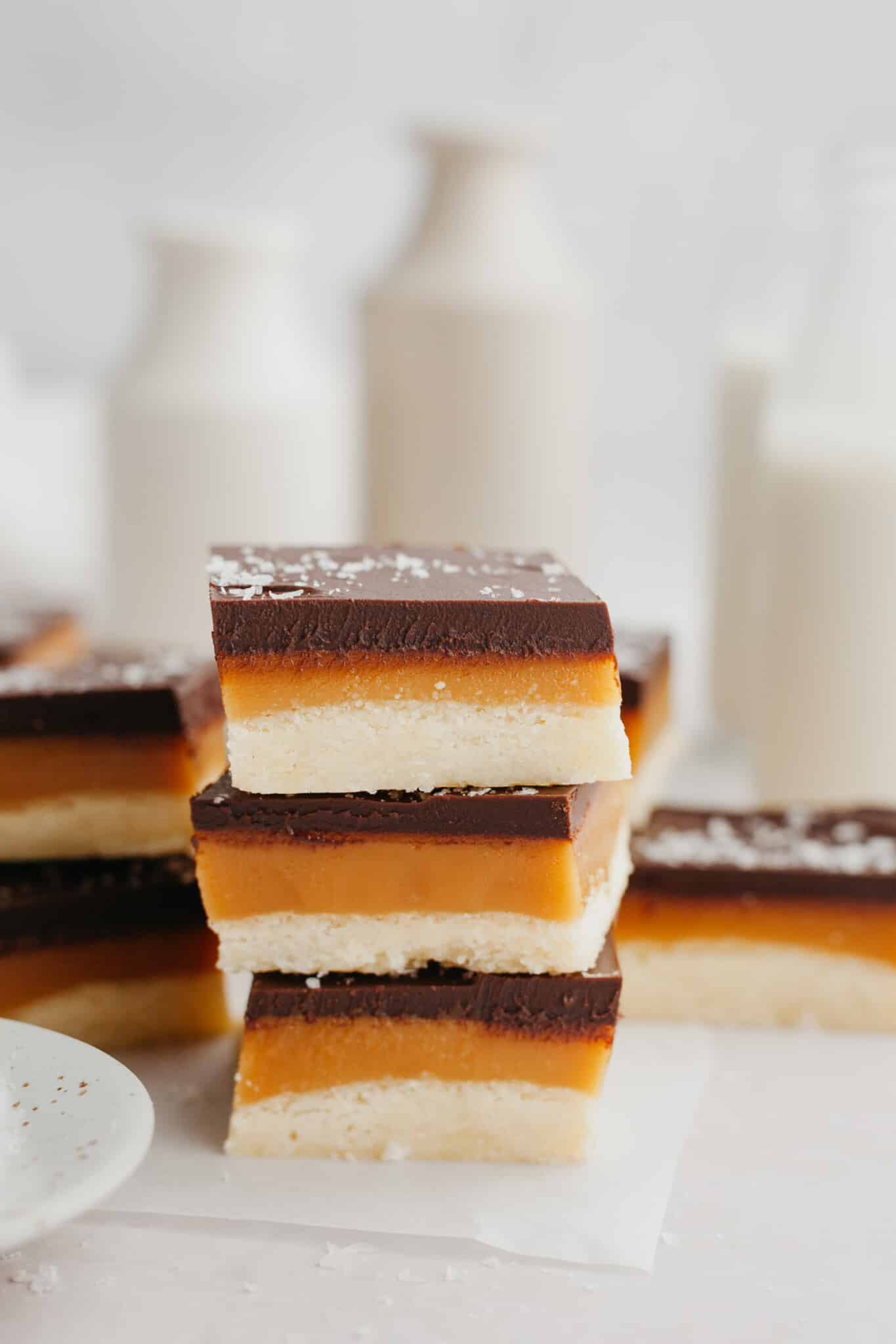 a stack of millionaires bars on a piece of parchment paper. 