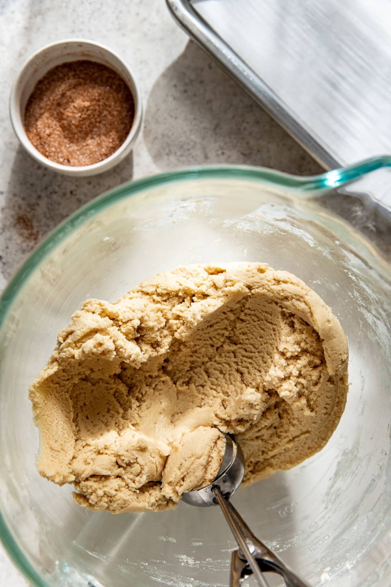 a cookie scoop scooping out cookie dough.