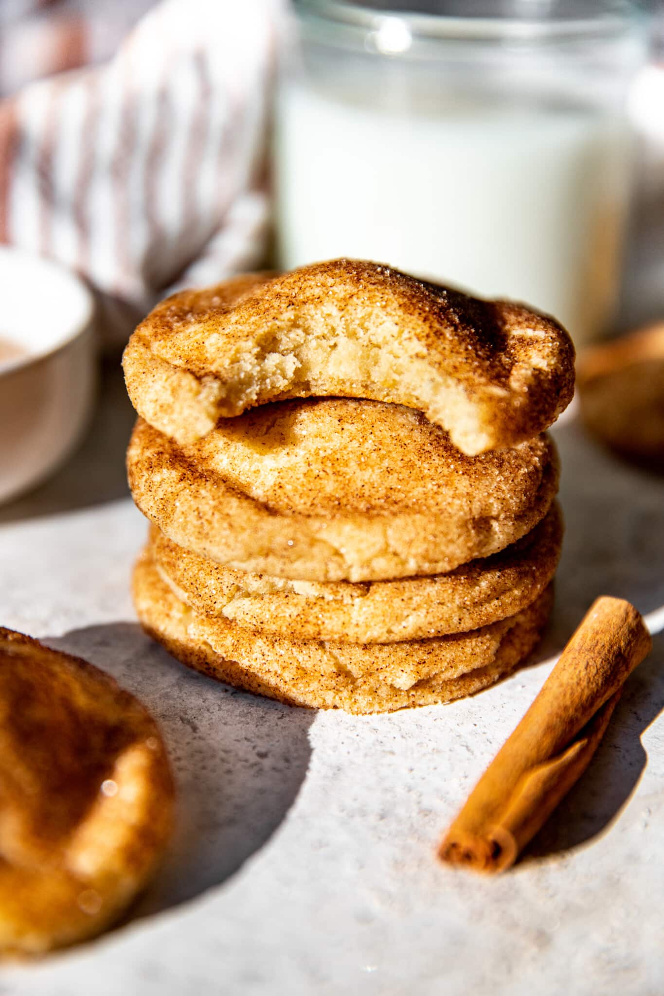 a bite taken out of a snickerdoodle cookie. 
