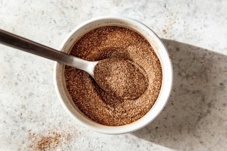 cinnamon sugar mix in a white ramekin with a spoon