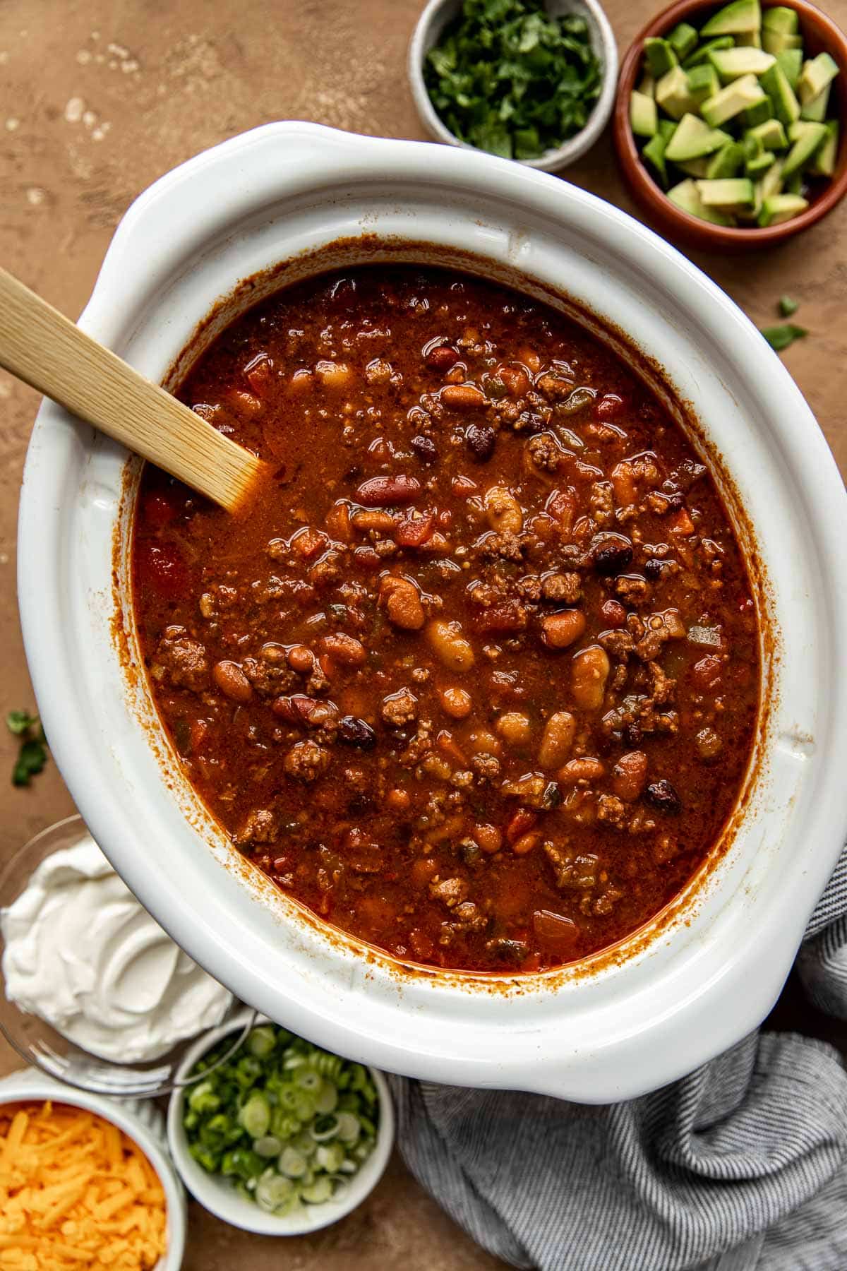 chili in a white crock pot. 