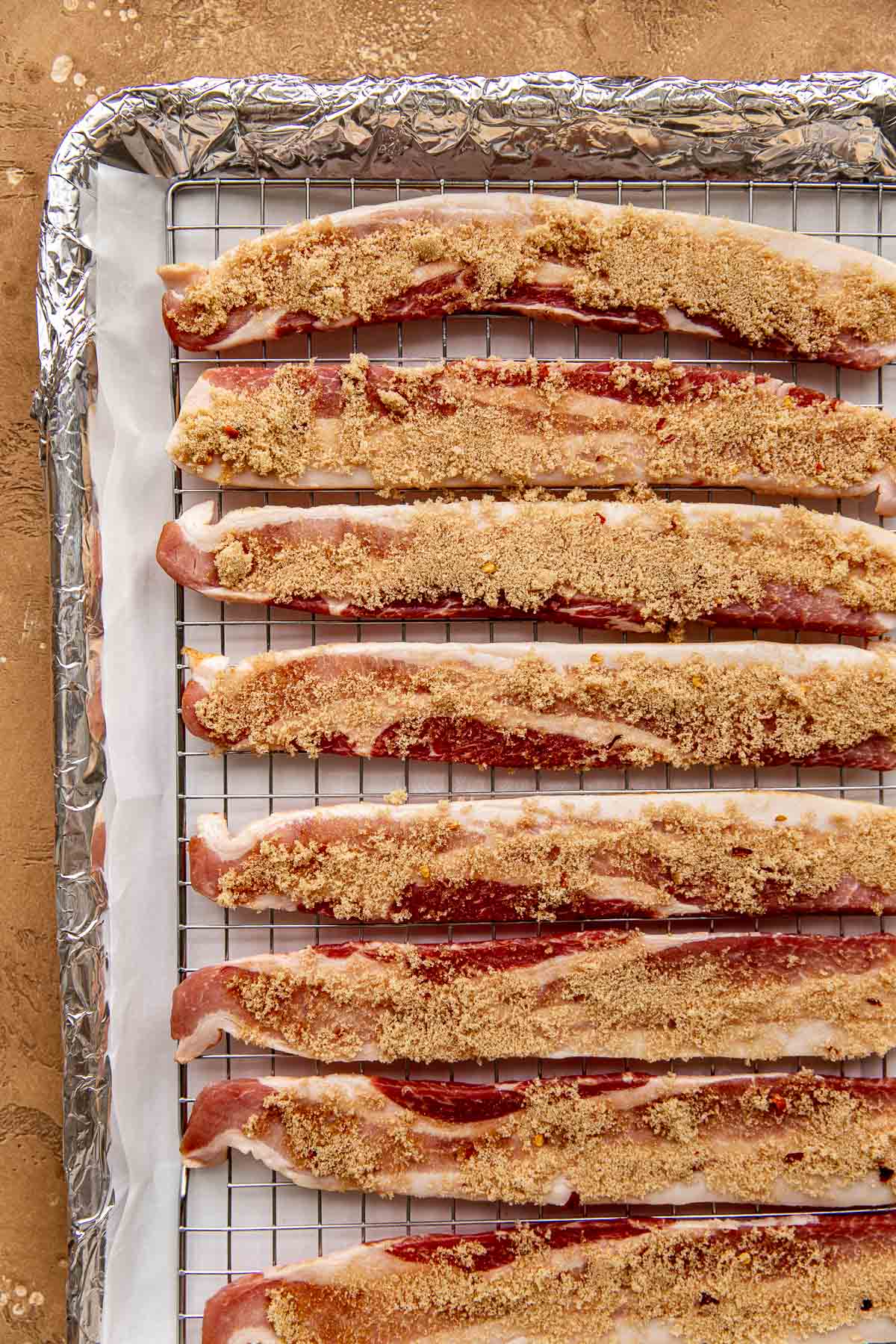 bacon on a sheet pan with brown sugar on top to make candied bacon.