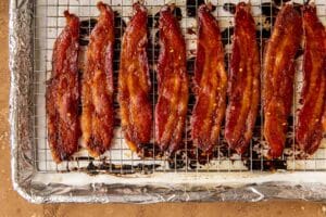 cooked bacon on a sheet pan.