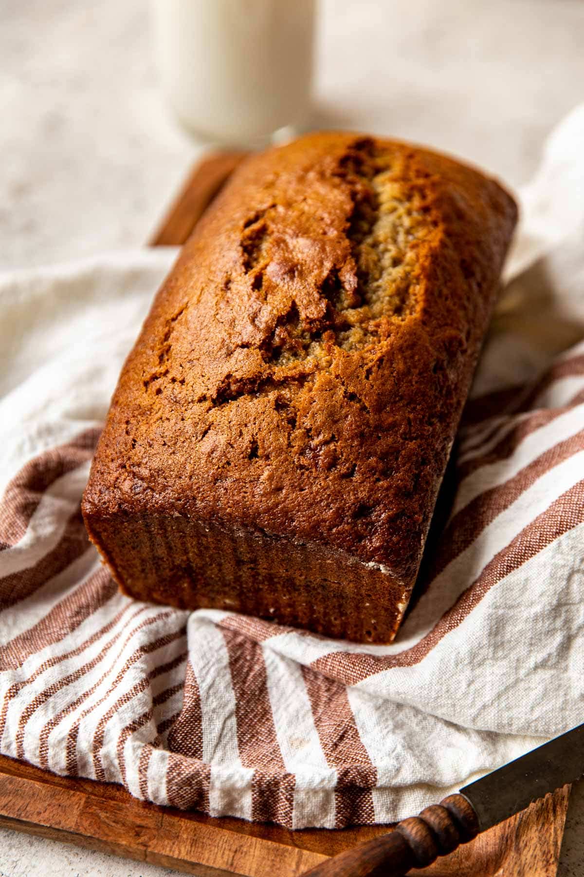 freshly baked banana bread on a cutting board.