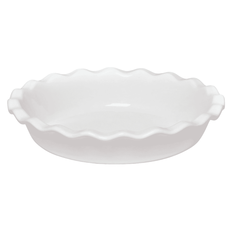 A white ceramic pie pan with scalloped edges.