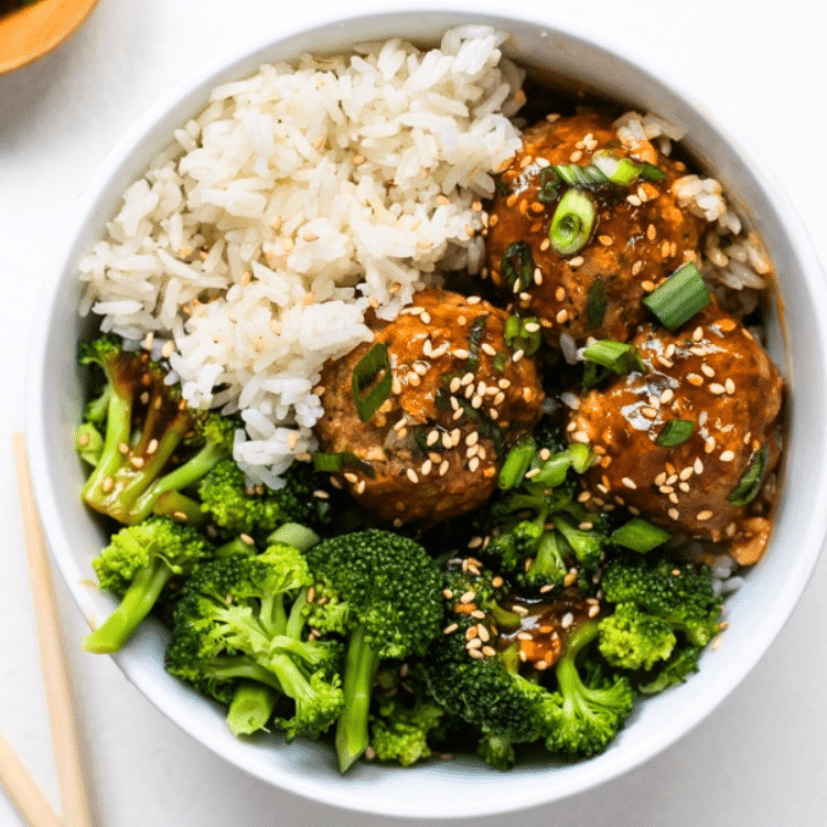 bowl with white rice, meatballs, and broccoli