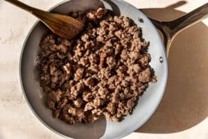 sausage in a frying pan.