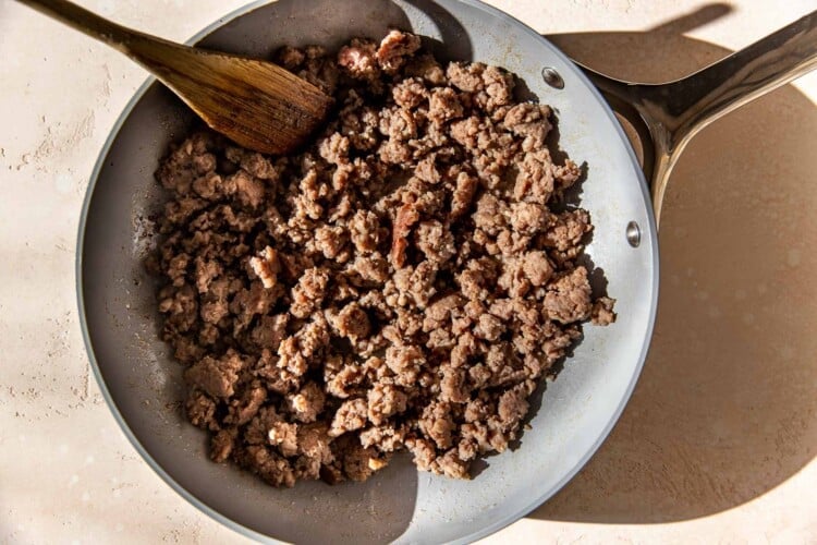 sausage in a frying pan.