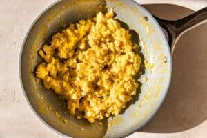 scrambled eggs in a frying pan.