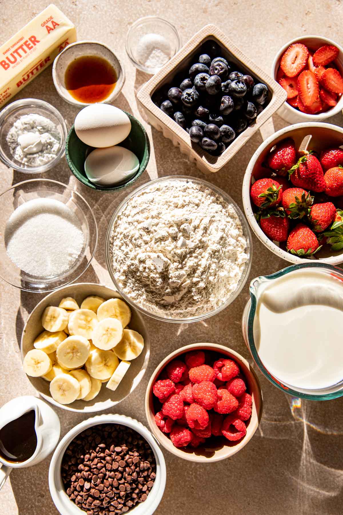 ingredients to make pancakes in bowls. 