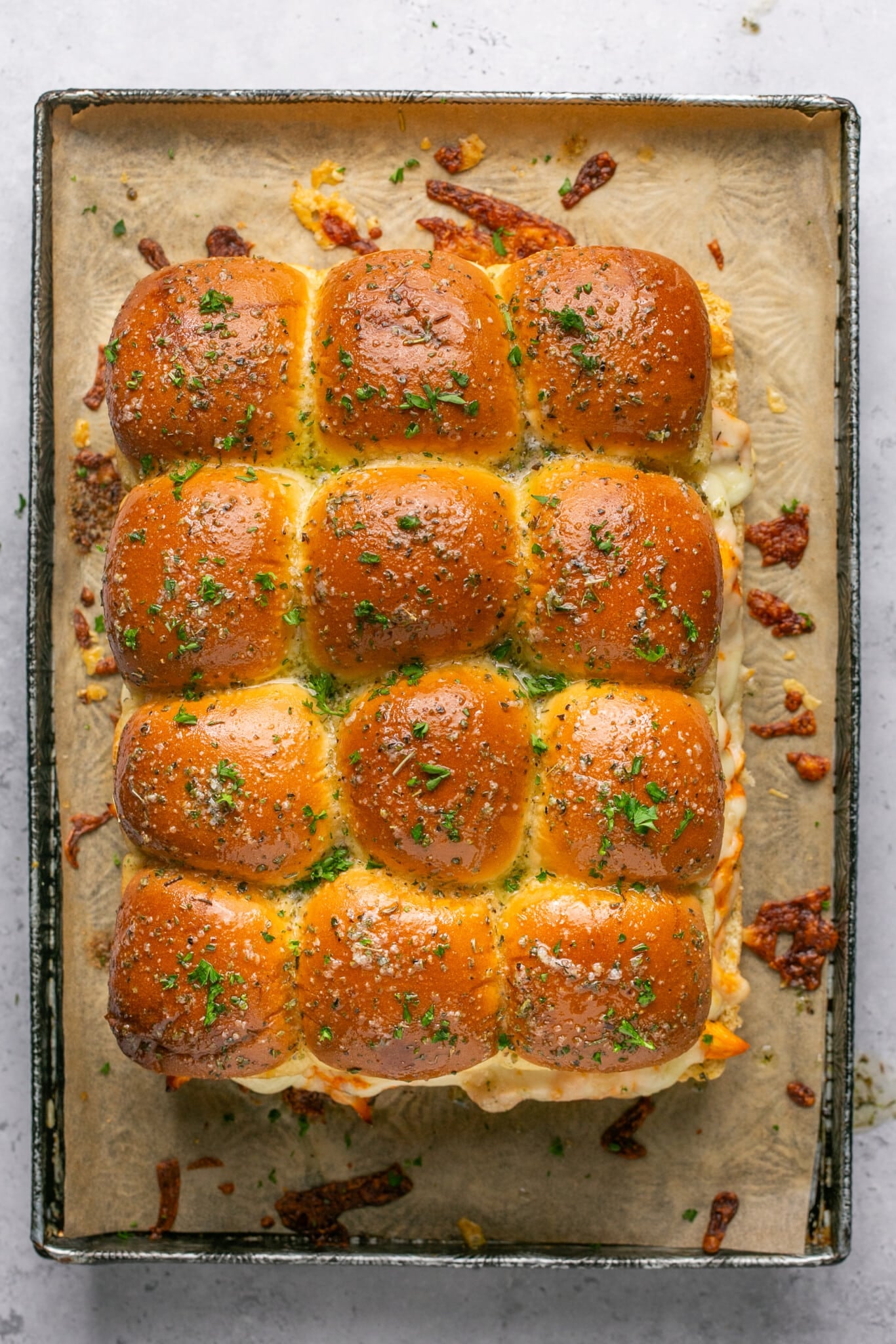 sliders on a sheet pan lined with parchment paper. 