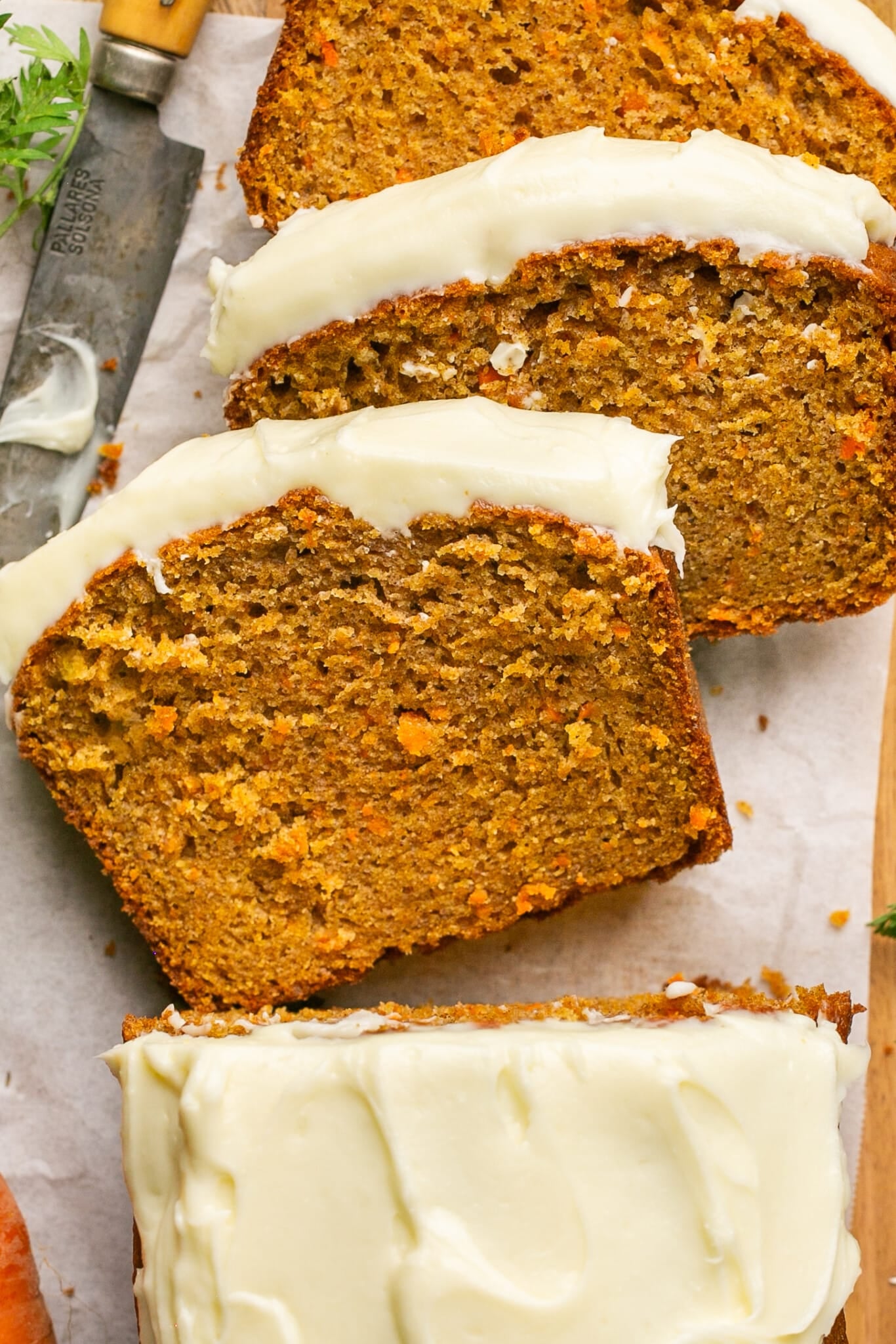 sliced carrot cake bread on a cutting board. 