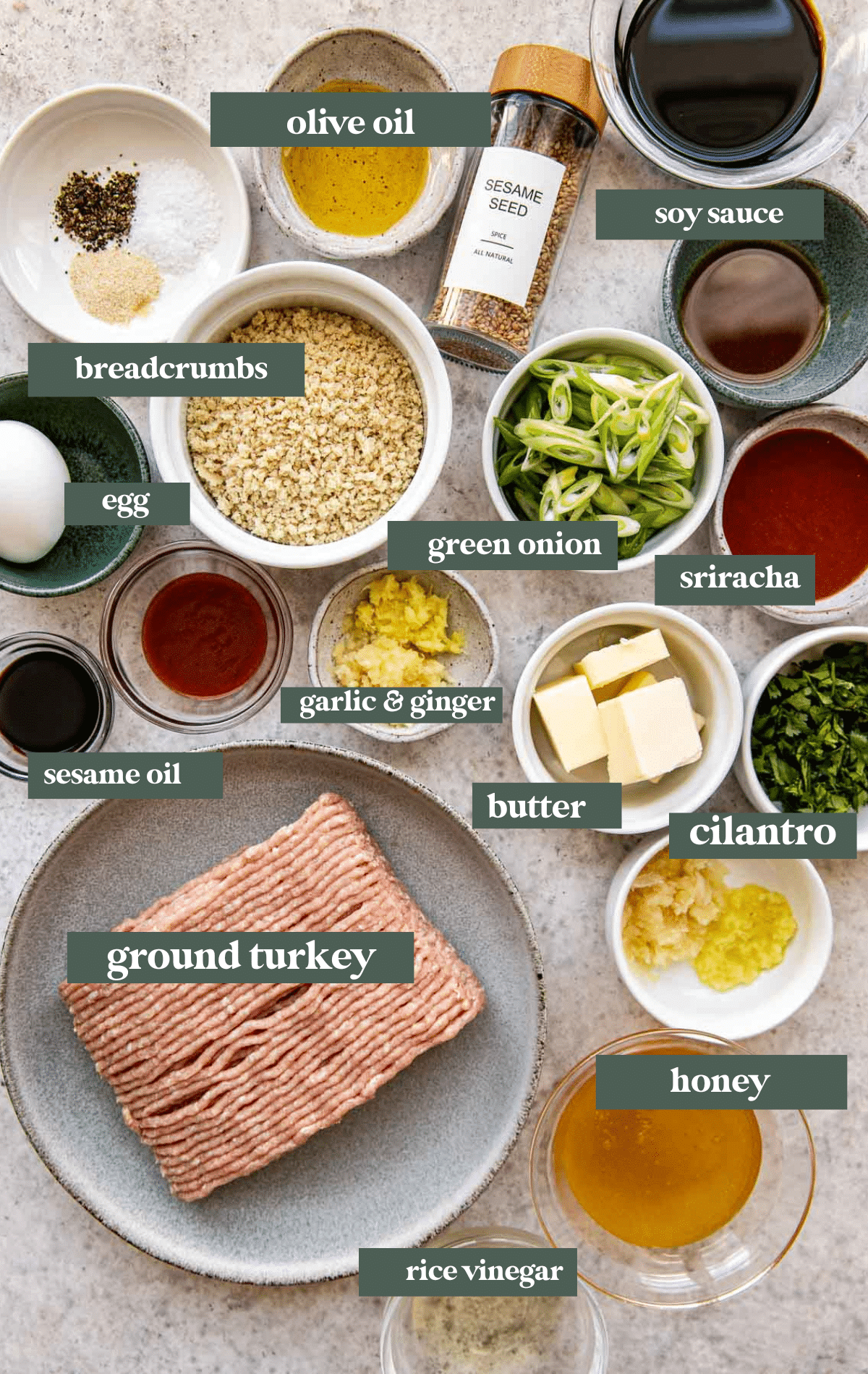 ingredients to make meatballs in small glass bowls. 