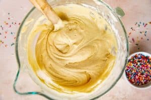 cake batter in a glass mixing bowl.