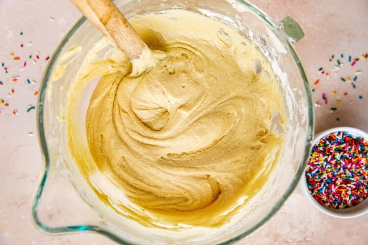 cake batter in a glass mixing bowl.