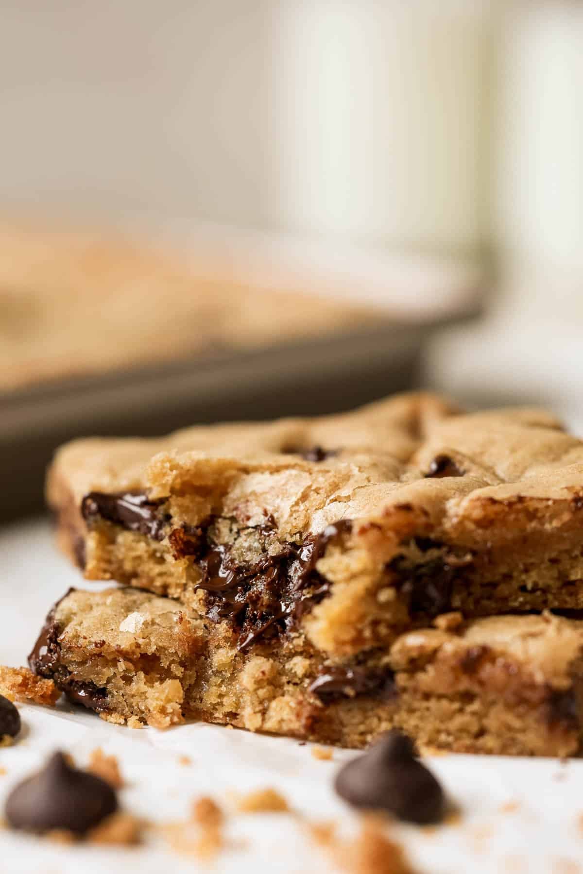a bite taken out of a sheet pan cookie. 