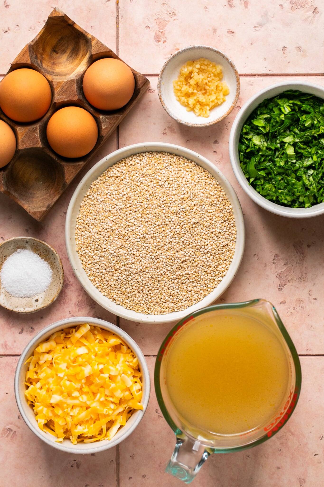 ingredients to make quinoa muffins in small glass bowls. 