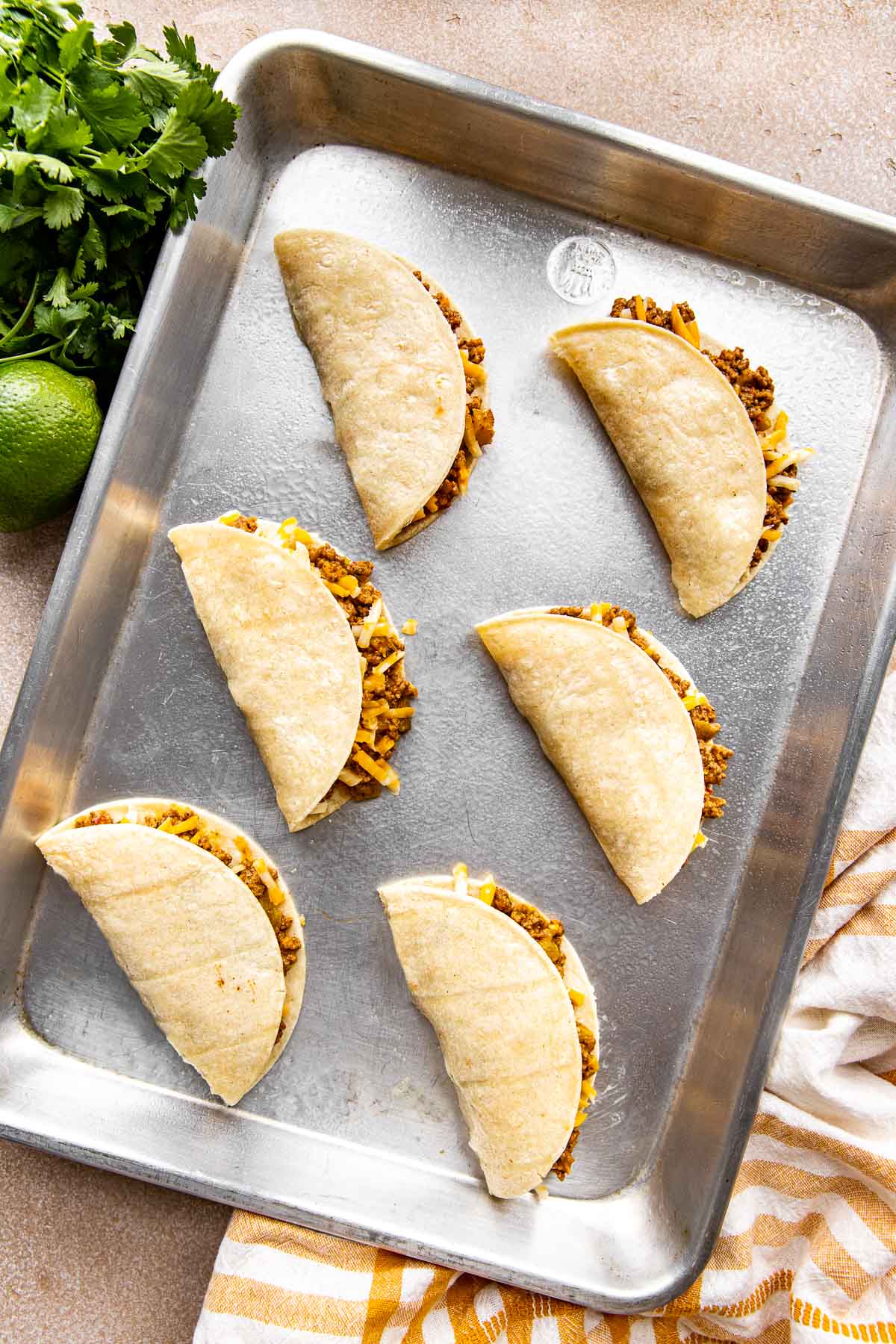 tacos on an aluminum sheet pan.