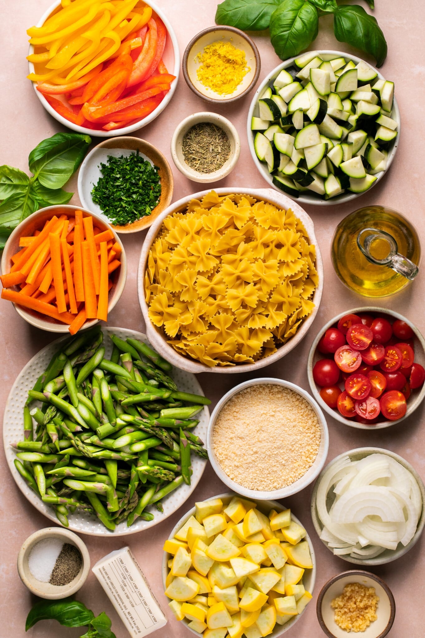 veggies and pasta in small glass dishes and bowls. 
