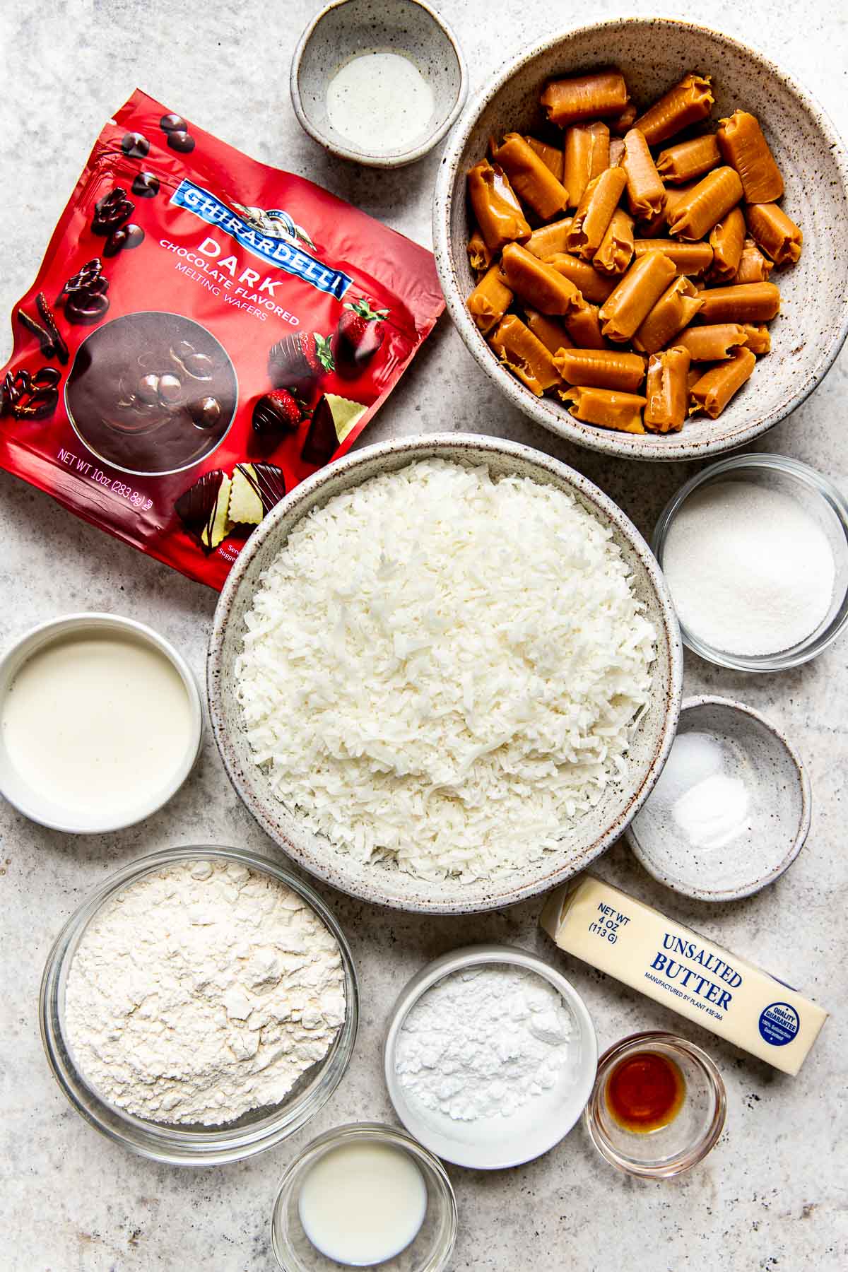 ingredients to make samoas cookies in glass bowls. 