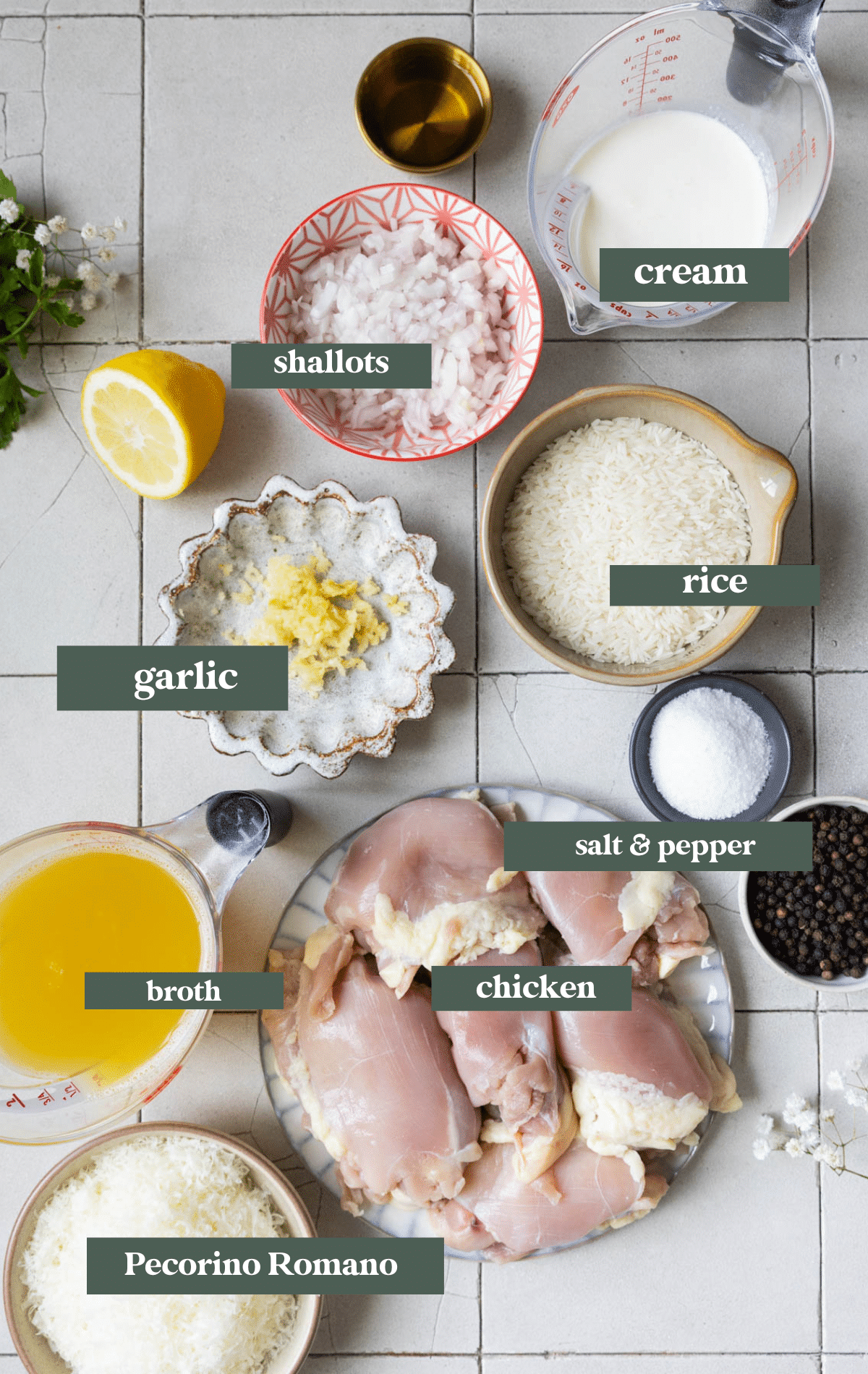 ingredients in small glass bowls and dishes to make chicken and rice.