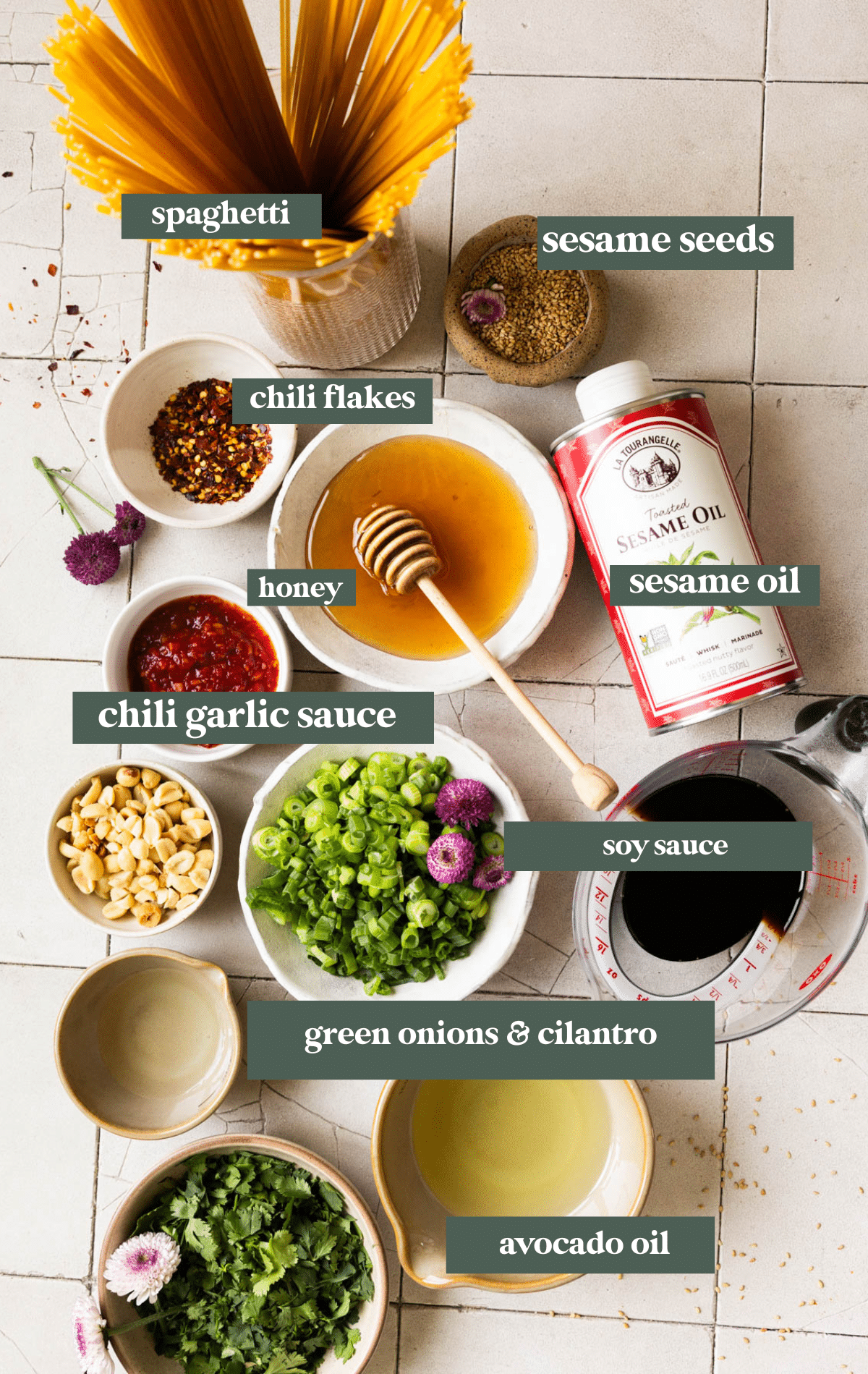 ingredients in small bowls needed to make sesame noodles. 