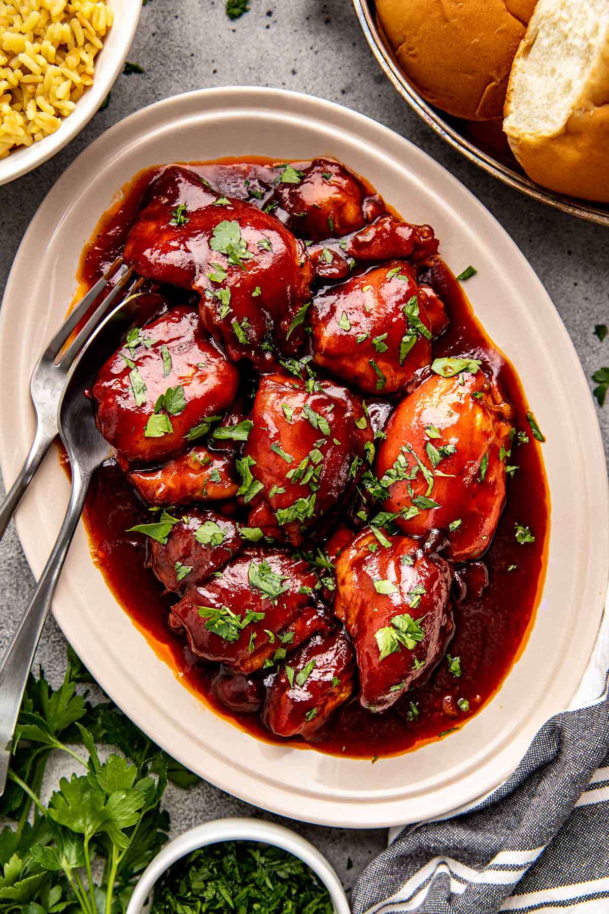 chicken thighs on a plate garnished with parsley.