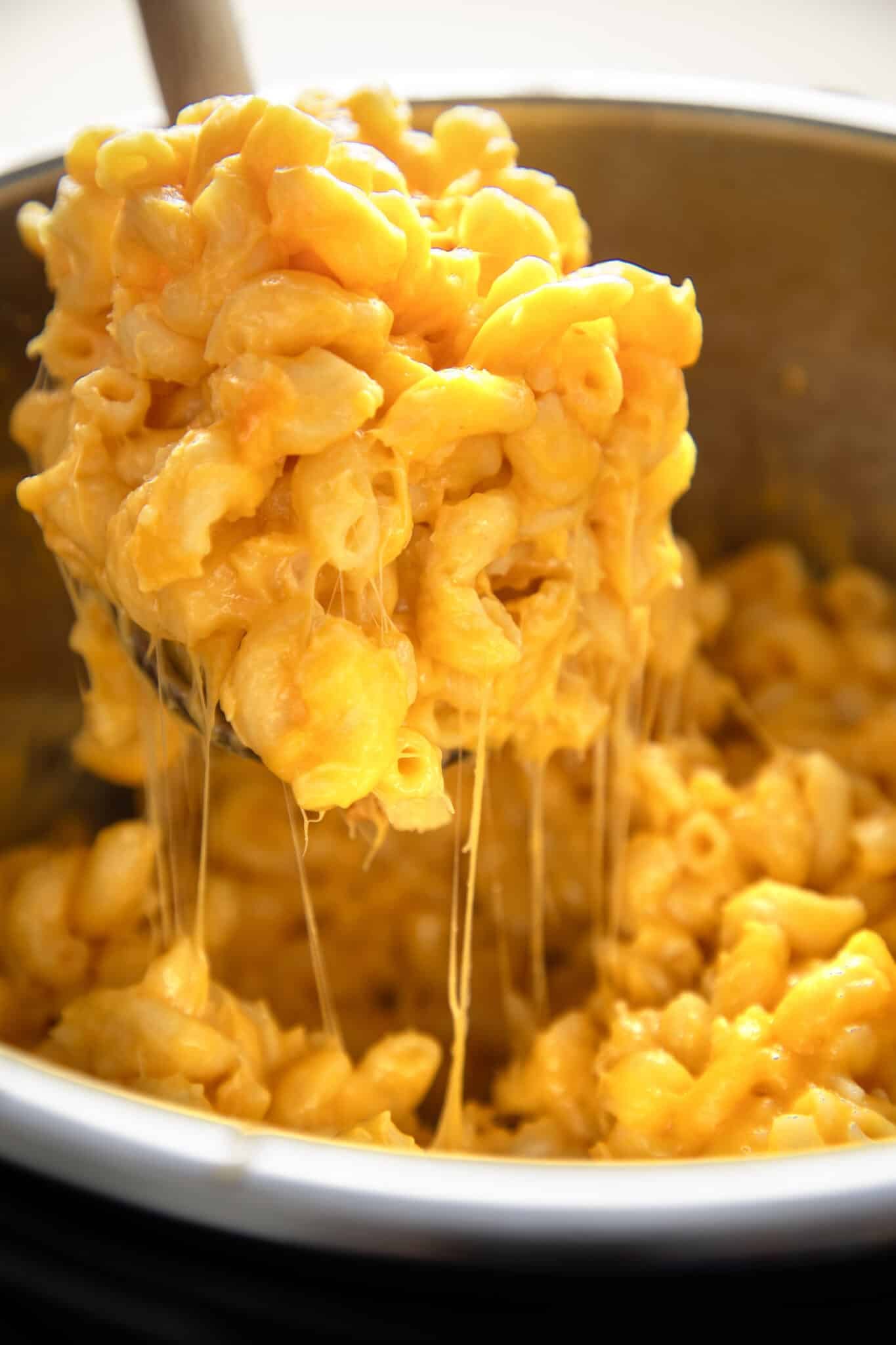 a spoon scooping mac and cheese out of the 