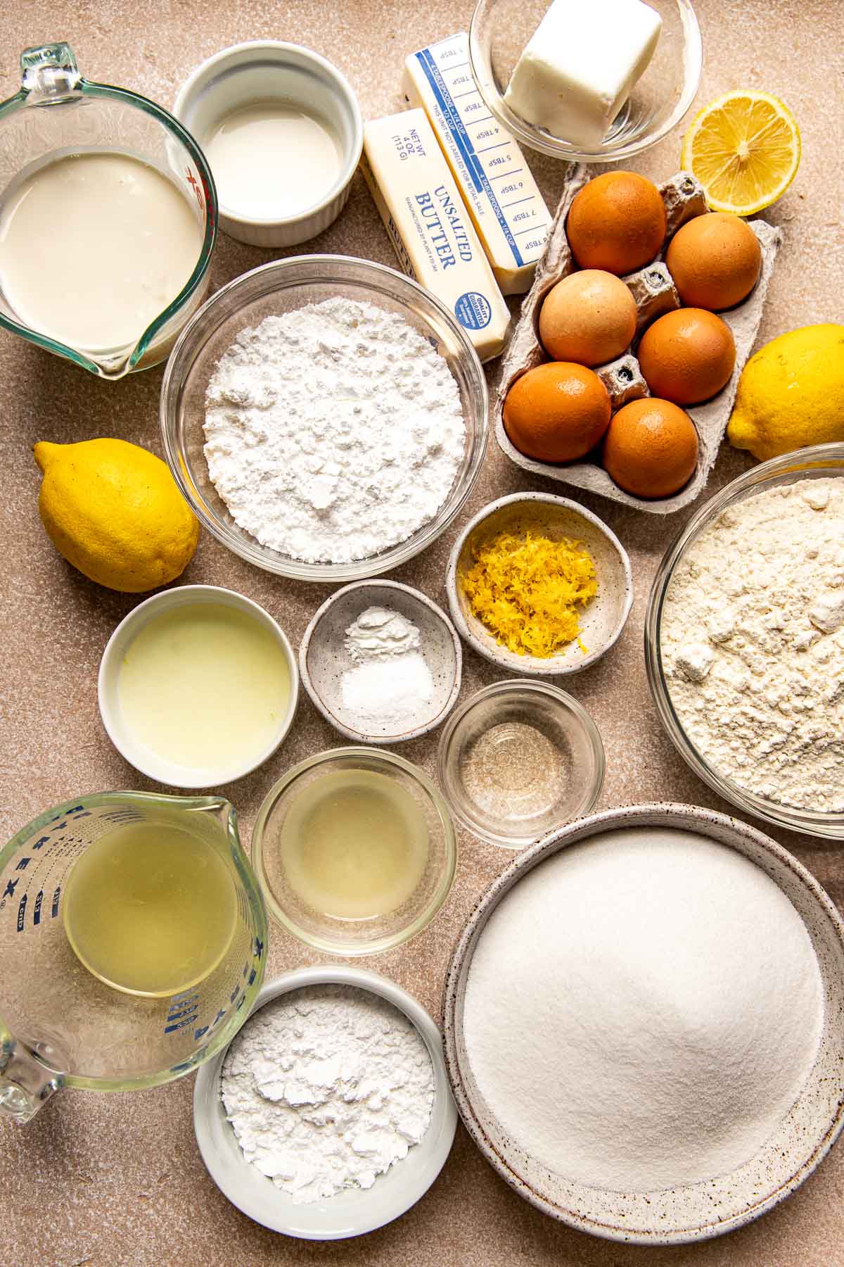 lemon pound cake ingredients in glass bowls. 