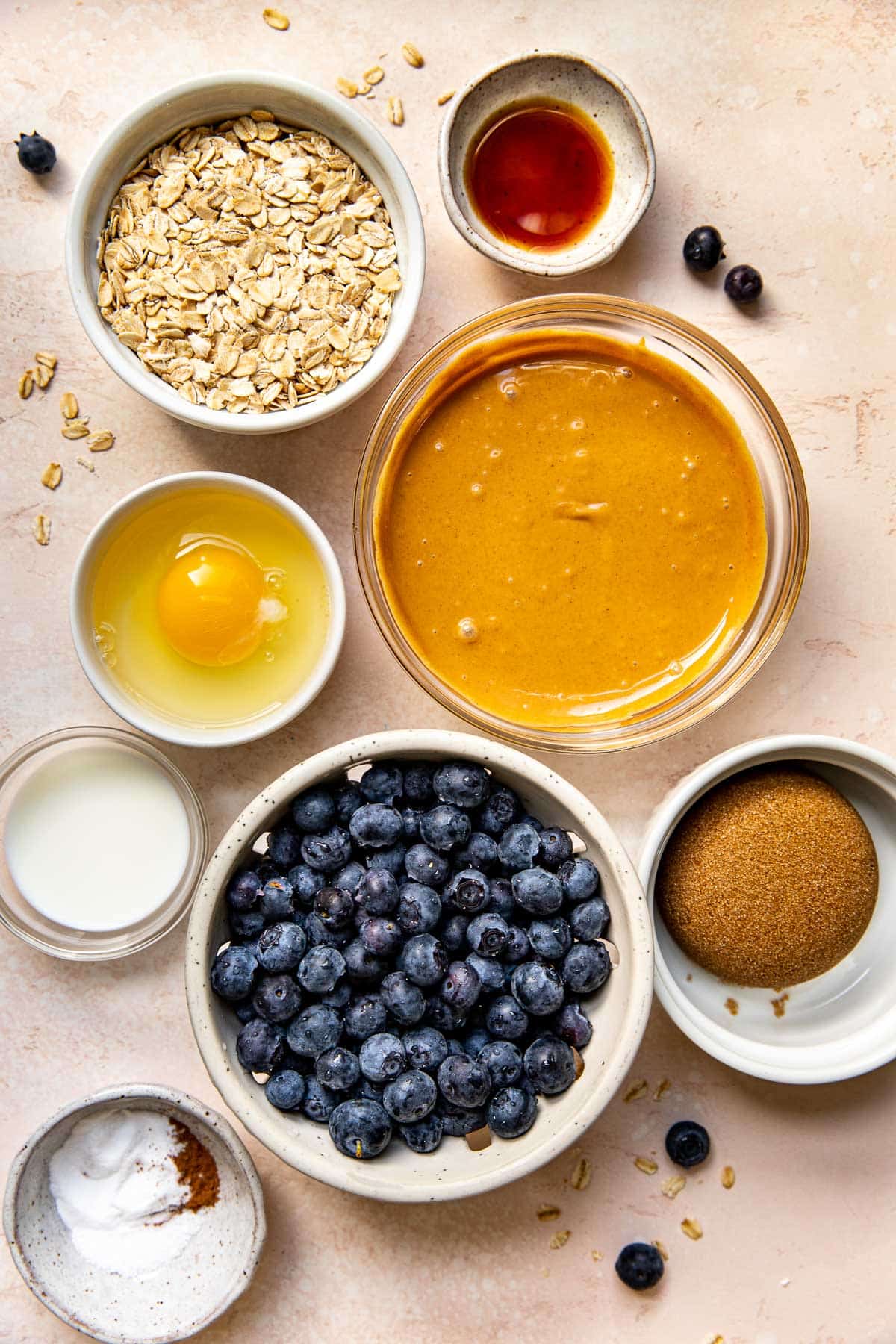 ingredients to make blueberry cookies in glass bowls. 