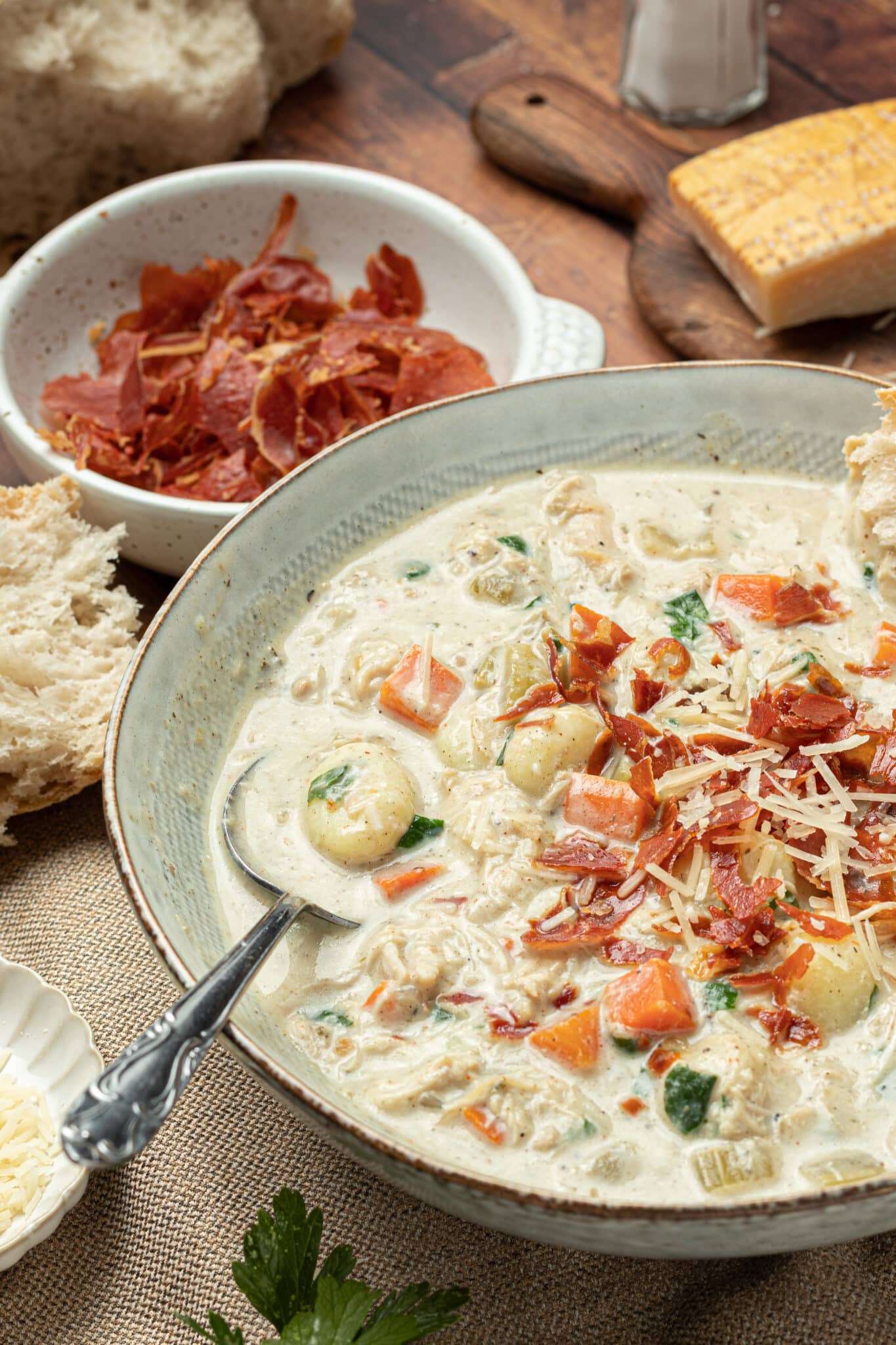 chicken gnocchi soup topped with crispy prosciutto.