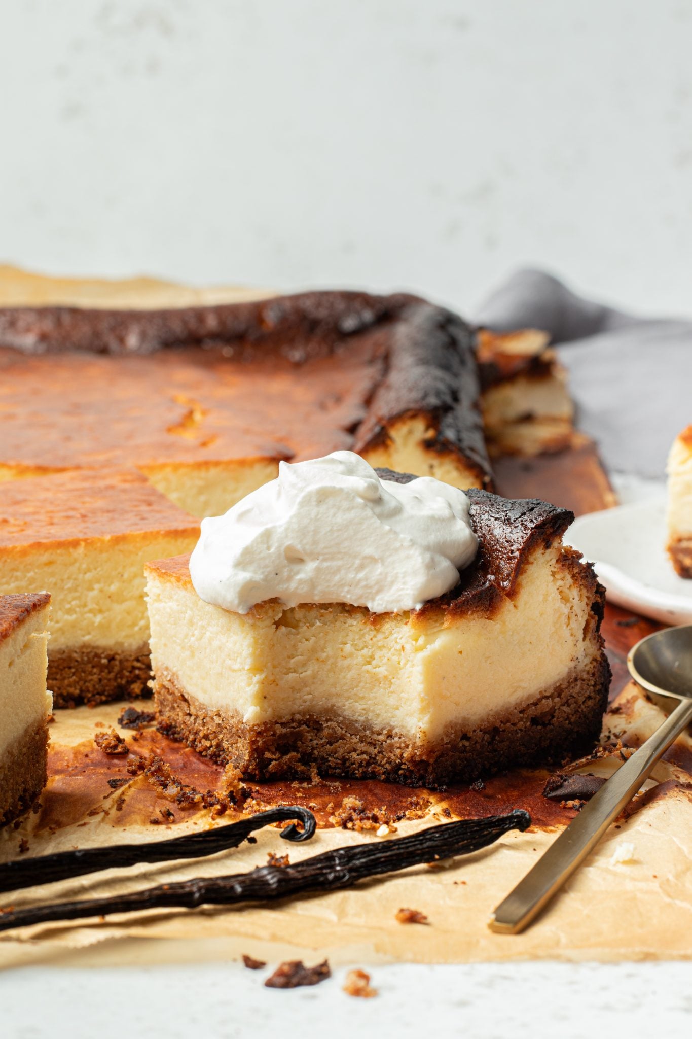 a bite taken out of a cheesecake bar.