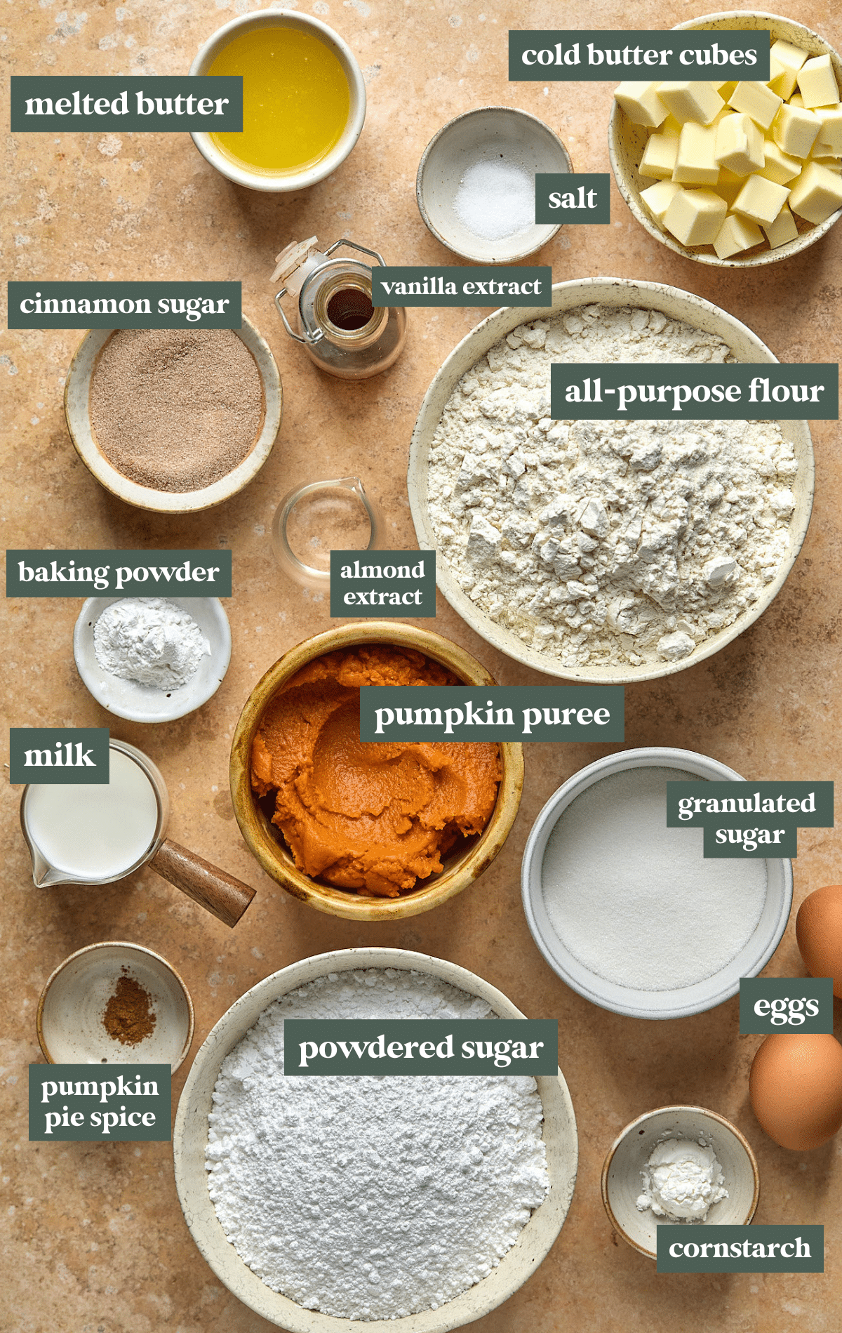 bowls of ingredients for sugar cookies with pumpkin topping