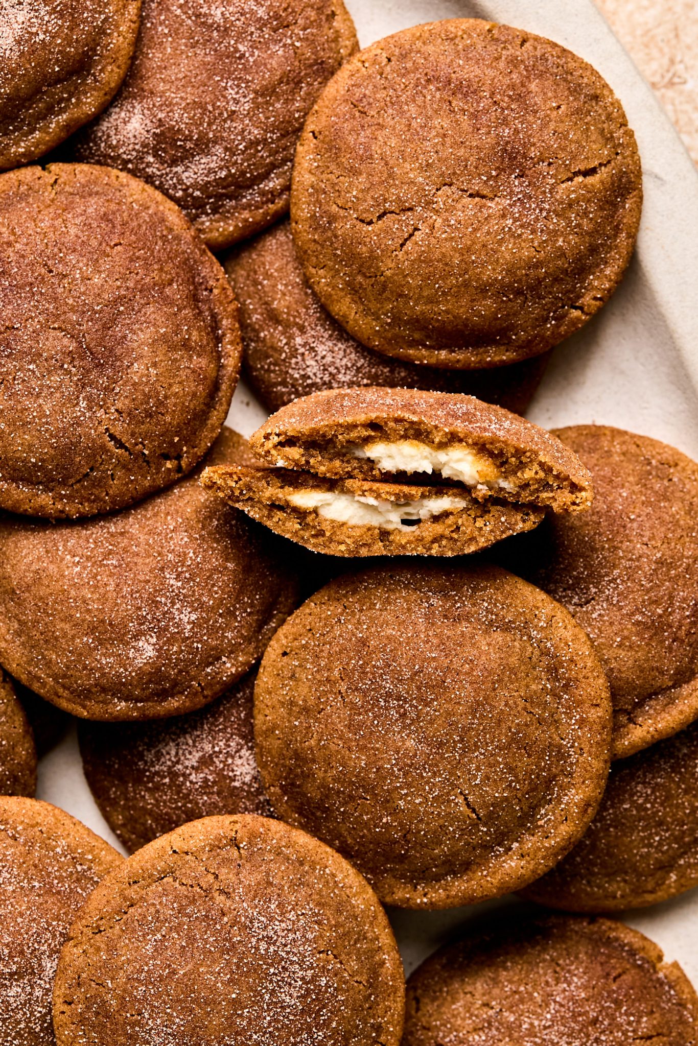 cheesecake inside of a gingerbread cookie sprinkled with cinnamon and sugar.