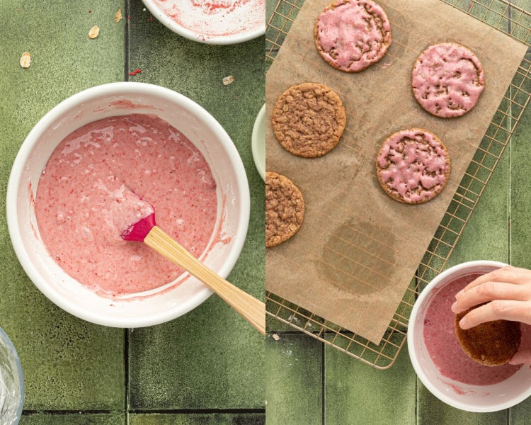 Left: A white bowl filled with pink strawberry icing, with a pink spatula resting inside. Right: Hand dipping the top of a baked oatmeal cookie into the strawberry icing, next to already-iced cookies on a cooling rack.
