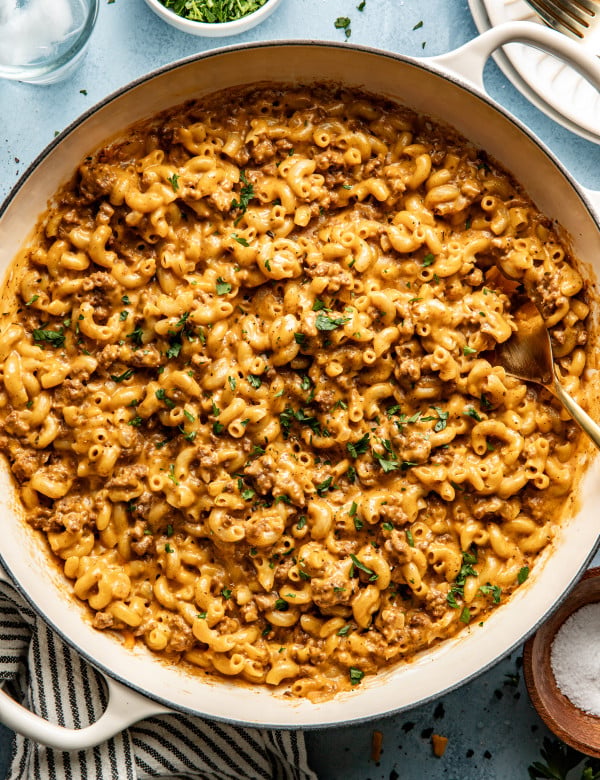 Hamburger macaroni in large pot with fork.