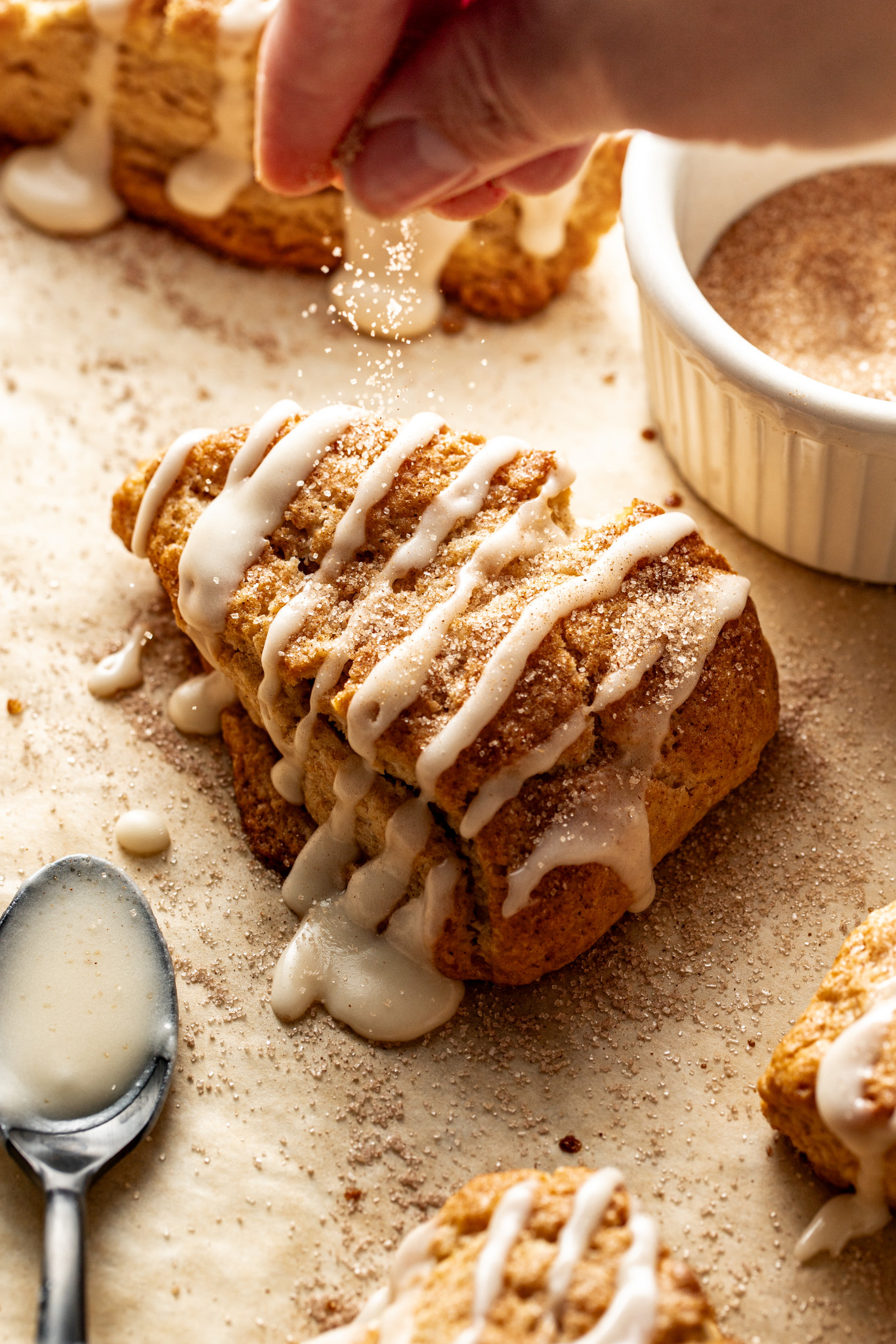 Sprinkle baked scone with cinnamon sugar topping.