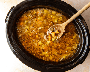 Soup cooked in slow cooker before adding kale.