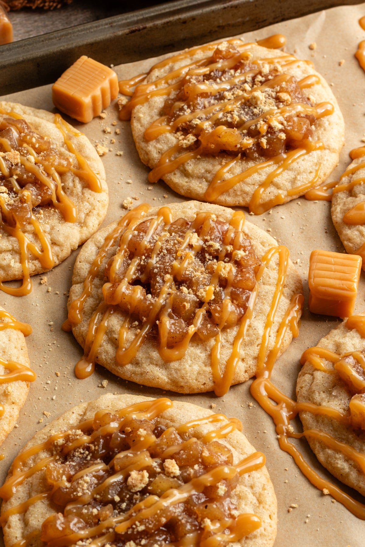 Apple pie cookies drizzled with caramel and coated with graham cracker crumbs.
