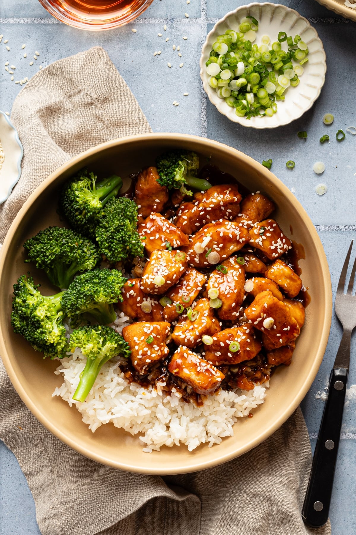 Honey garlic chicken in bowl with rice and broccoli.