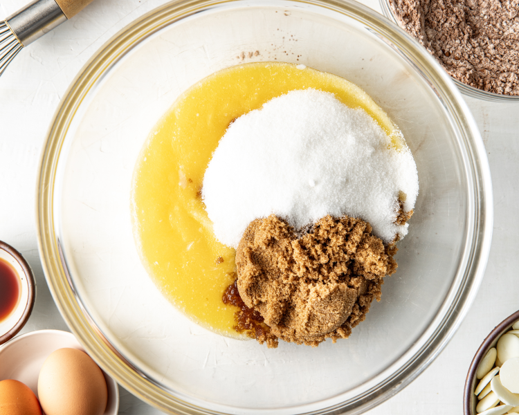 Melted butter and sugars in mixing bowl.