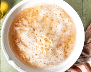 Soaking the shredded potatoes in cold water.