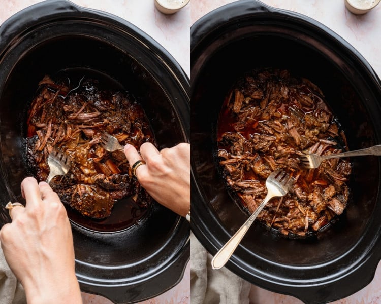 Cooked chuck roast being shredded with two forks in the slow cooker until tender and pulled apart.