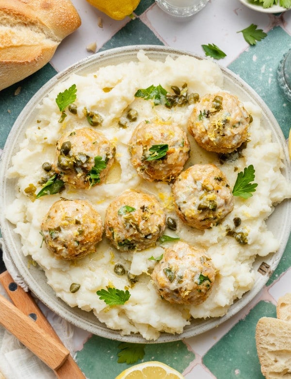 Chicken piccata meatball served on top of mashed potatoes.