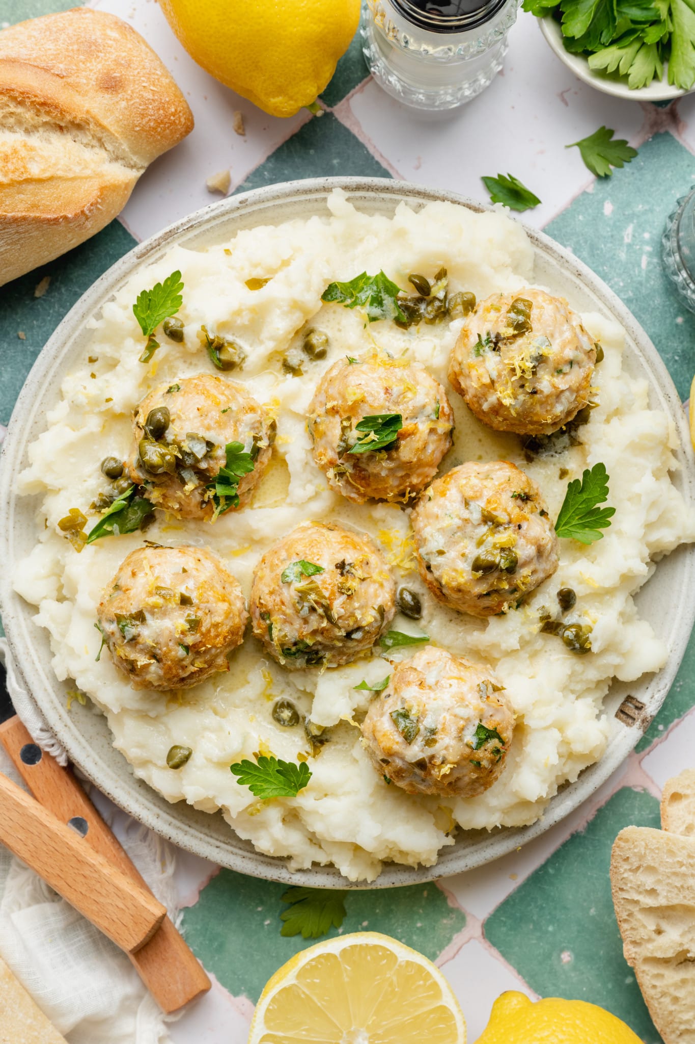 Chicken piccata meatball served on top of mashed potatoes.